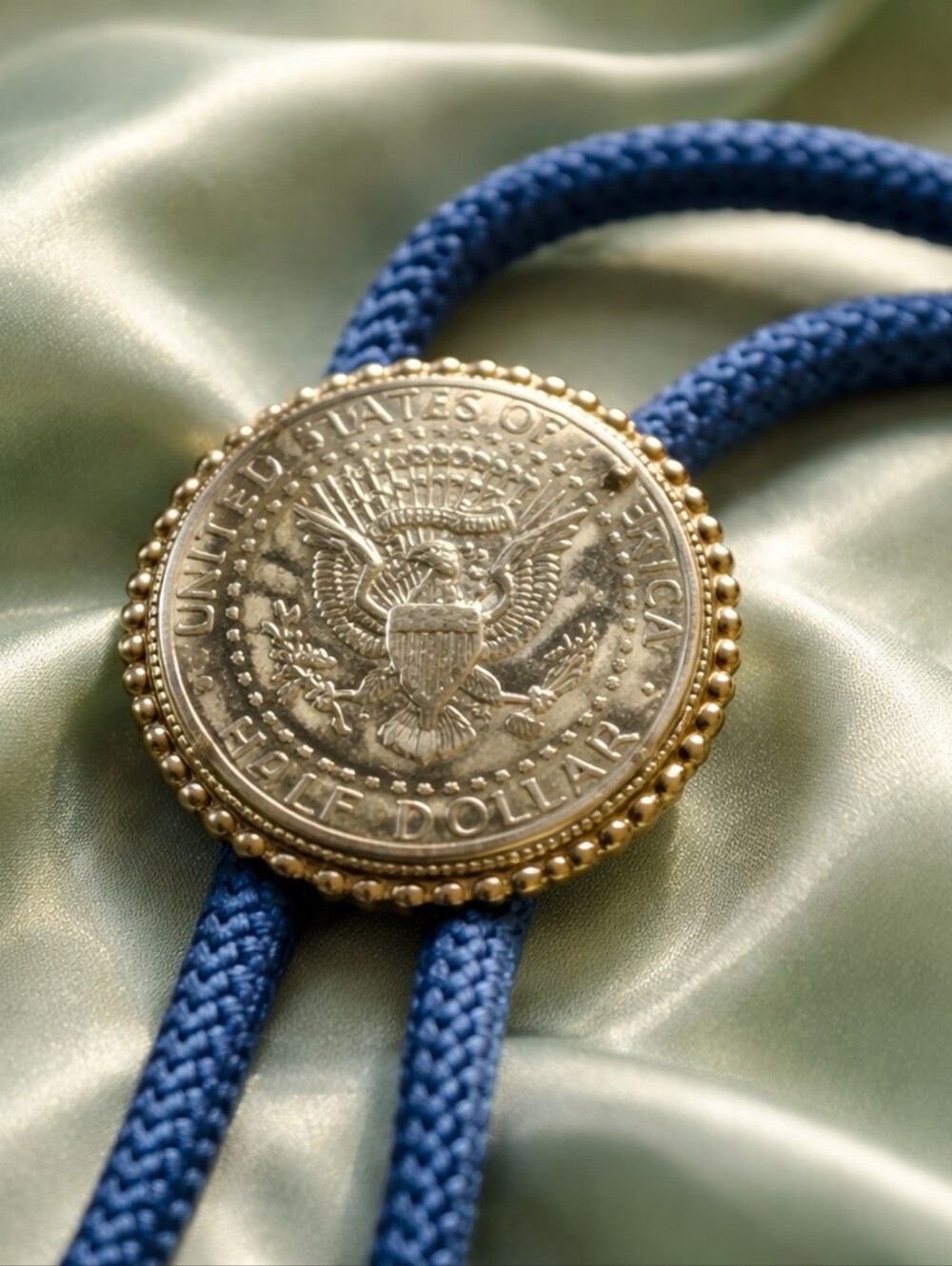 Vintage Kennedy Half Dollar Bolo Tie – Blue Cord Western Style Coin Accessory